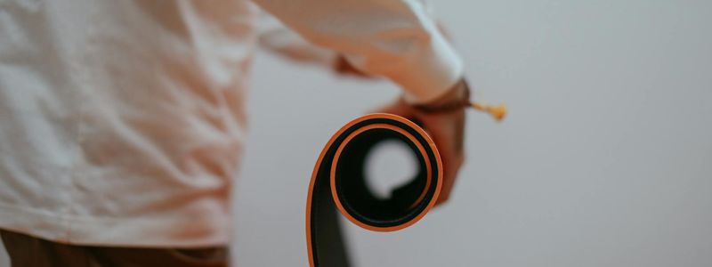 Top-down view of a yoga mat rolled out in a calm space.